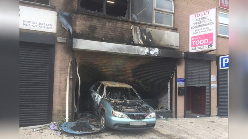 &nbsp;A burnt out car in a hairdressers. Picture by Hugh Russell