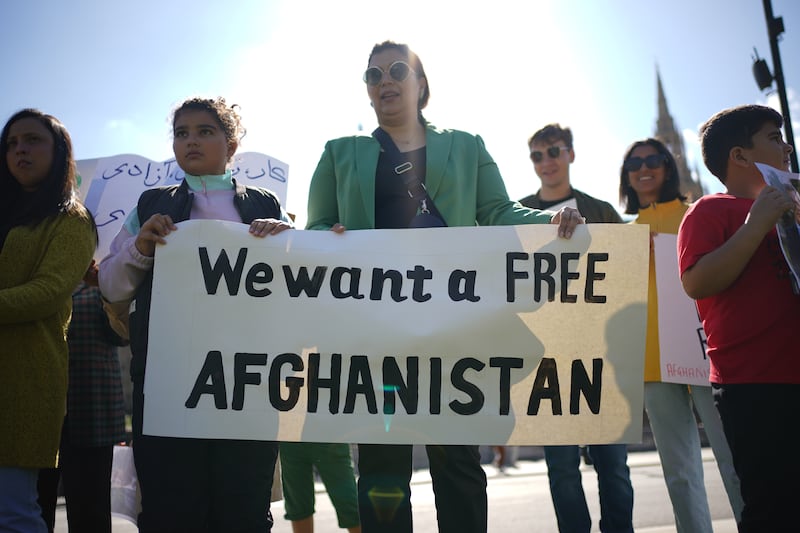People protesting in Parliament Square in London on the anniversary of the Taliban takeover of Afghanistan