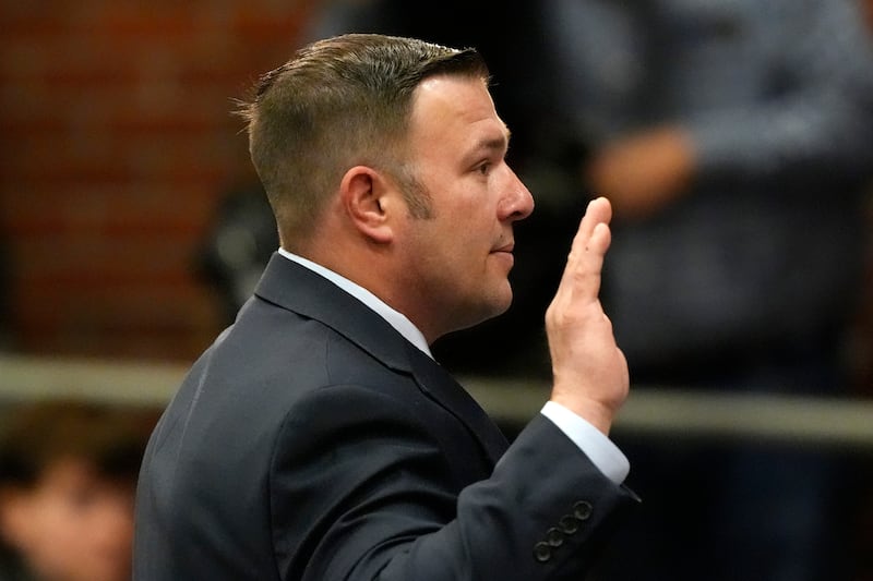 Daryl Reed, a member of the US Army Reserves, is sworn in before giving testimony (Robert F Bukaty/AP)