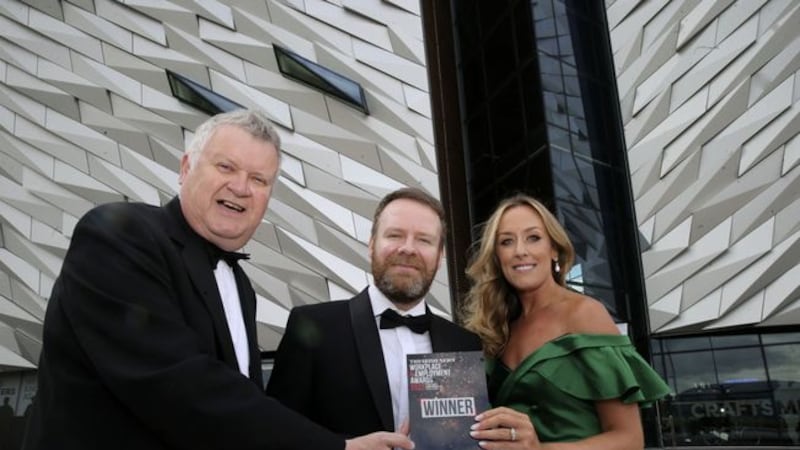 Irish News group marketing and communications manager Annette McManus and business editor Gary McDonald with awards host and comedian Neil Delamere