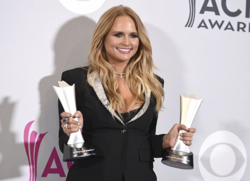 Miranda Lambert poses in the press room with her awards for album of the year for 