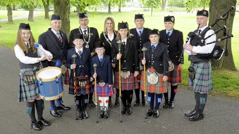 Armagh City, Banbridge &amp; Craigavon Borough Council mayor Mealla Campbell joins RSPBA president George Ussher, director Kenny Crothers and local band members at the launch of UK pipe band championships taking place in Lurgan Park on Saturday June 15. Photo: Edward Byrne 