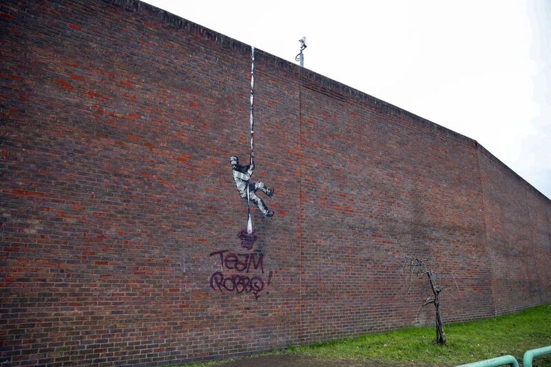 The Banksy artwork which was painted on the side of the former prison in Reading has now been defaced.