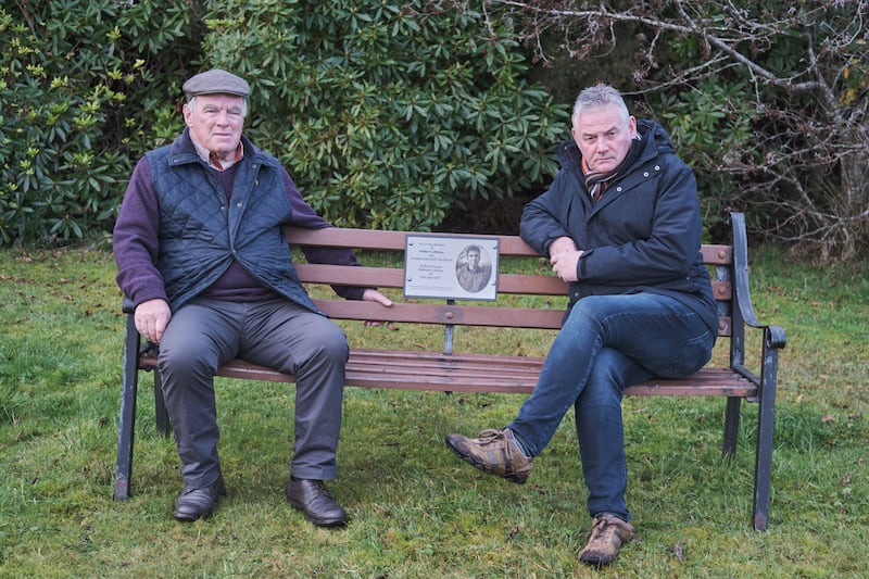 Kevin Magee and Finbar's Cafferkey's father sitting on a memorial bench dedicated to his late son