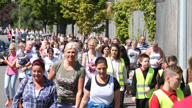 Children from Holy Cross and Ballmacward Primary schools along with parents take part in a road safety walk in memory of Conor O&#39;Neill who was struck by a car and died as he cycled in Rosehead before school last year Picture Mal McCann. 