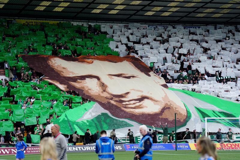 Celtic fans unveil a banner of Tommy Burns