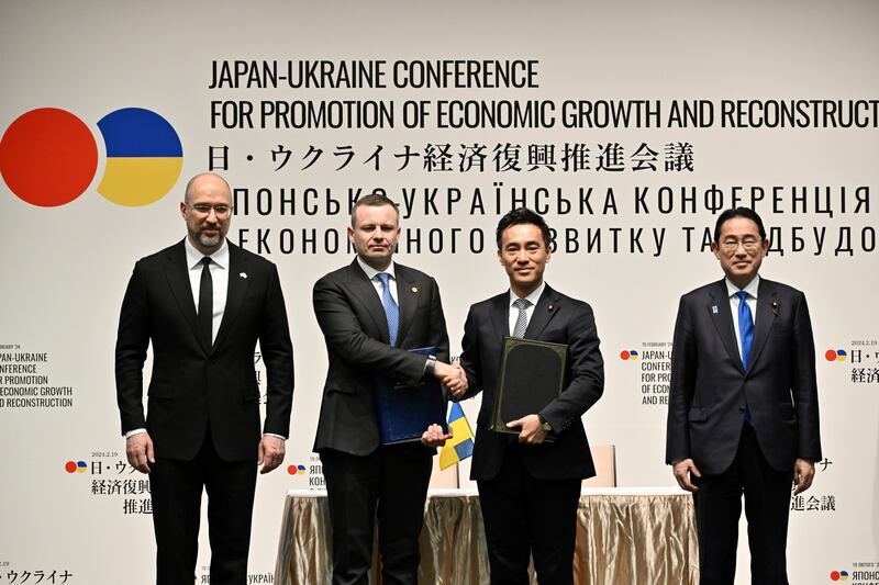 Ukraine’s Prime Minister Denys Shmyhal, far left, and Japanese Prime Minister Fumio Kishida, far right, with other officials, during the Japan-Ukraine Conference for Promotion of Economic Growth and Reconstruction in Tokyo (Kazuhiro Nogi/Pool Photo via AP)