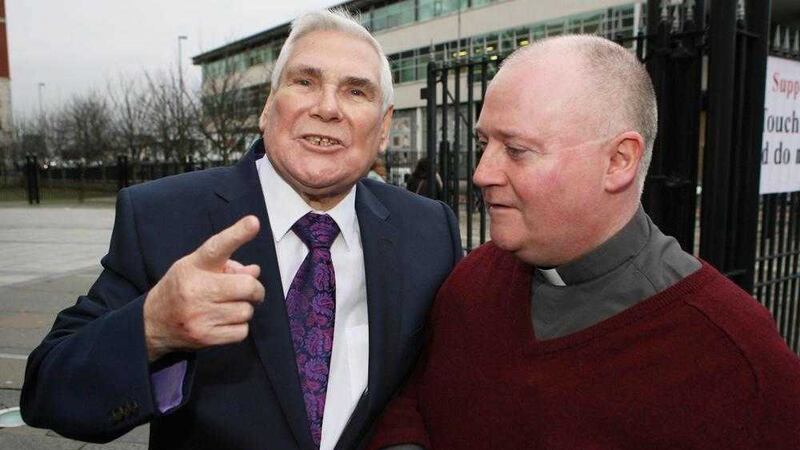Pastor McConnell with Fr Patrick McCafferty outside Laganside court during an earlier hearing.  Picture by Matt Bohill 