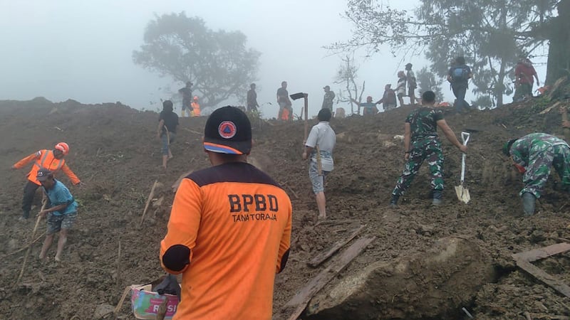 Rescuers search for victims of a landslide in Tana Toraja, South Sulawesi, Indonesia (BPBD Tana Toraja via AP)