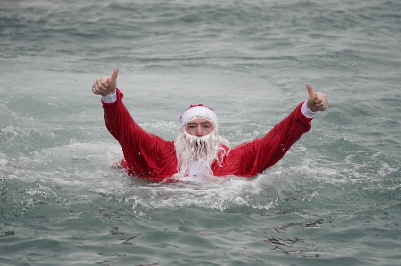 Patrick Corkery dressed as Santa in the “unseasonably warm” sea.