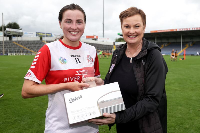 Derry's Aine McAllister is presented with the Player of the Match award by Ulster delegate Karen McCormack