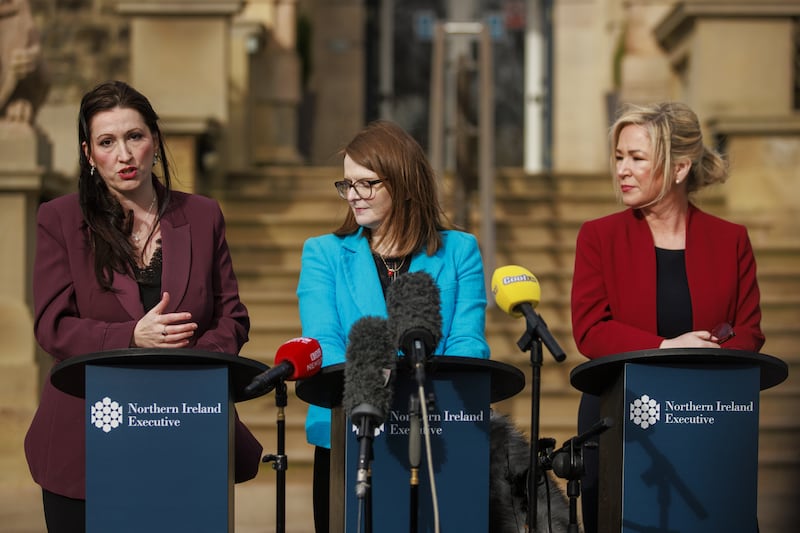 Deputy First Minister Emma Little-Pengelly (left) speak to the media as First Minister Michelle O’Neill (right) and Minister of Finance Caoimhe Archibald (centre) look on