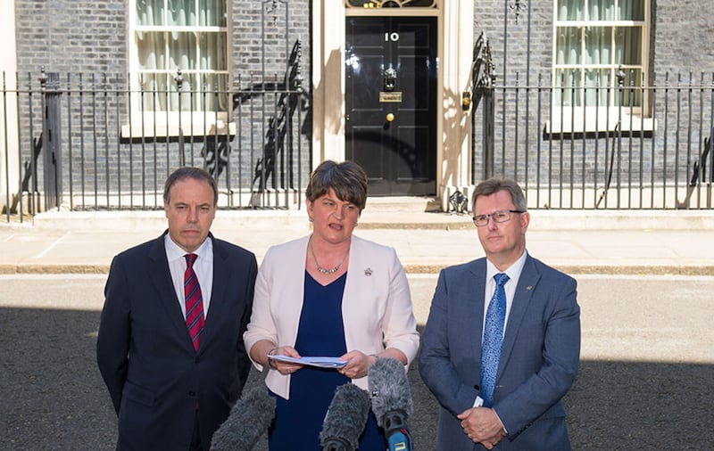 DUP leader Arlene Foster, DUP deputy leader Nigel Dodds (left) and MP Sir Jeffrey Donaldson outside 10 Downing Street in London after the party agreed a deal to support the minority Conservative government&nbsp;