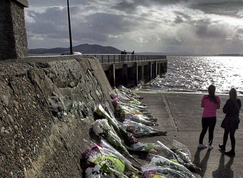 Floral tributes were left at Buncrana Pier in the days after the March 2016 tragedy. Picture by Margaret McLaughlin 