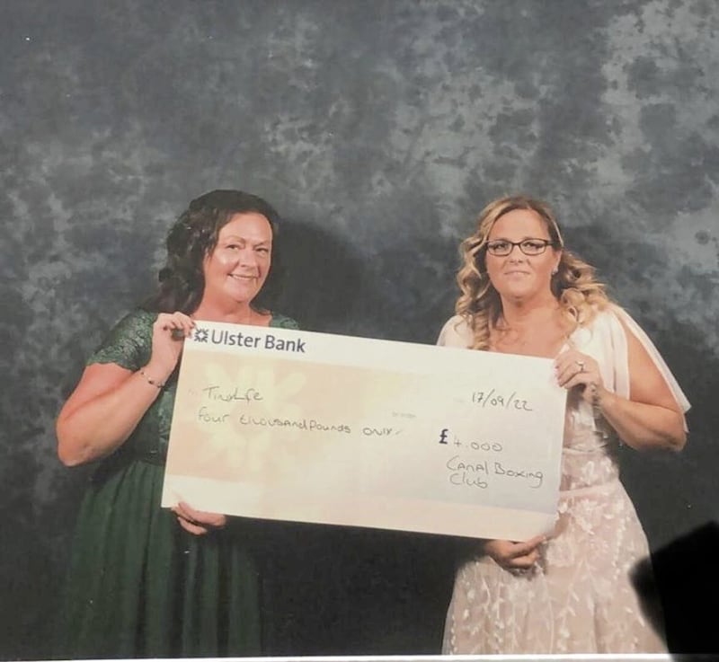 Canal Boxing Club&#39;s Nicola Russell presents a cheque to Cathy Rodgers from TinyLife. Picture by Lisburn Photography Studio 