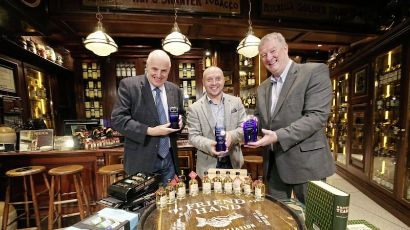 The Friend at Hand owner Willie Jack (left) and Michael McKervey from Fresh Interior Design with Les McCracken (right), managing director of McCue Crafted Fit, which secured a major industry award in London for its work on the Belfast off-licence 