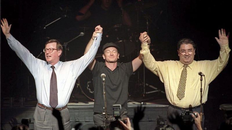 David Trimble and John Hume with Bono at Belfast&#39;sWaterfront Hall at concert in 1998 to promote a Yes vote in the Good Friday Agreement referendum 