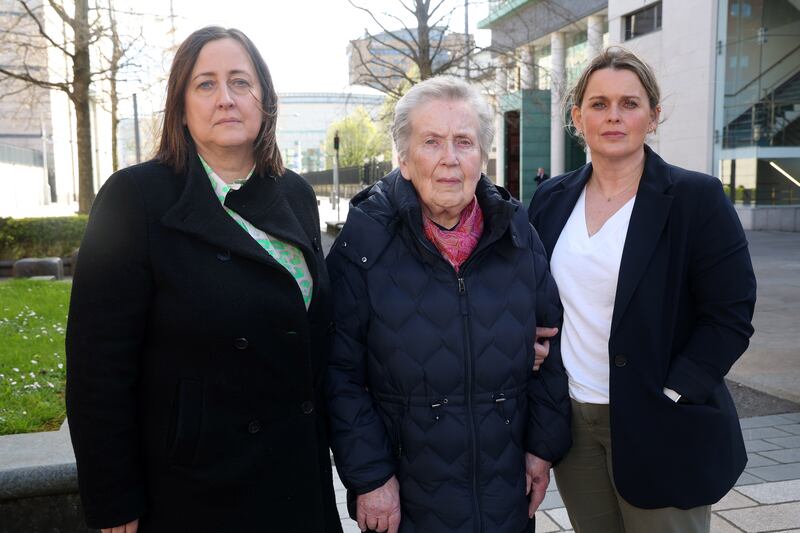 Bridie Brown, the wife of Sean Brown, with his daughters Siobhan Brown (left) and Claire Loughran (front right)  outside the Royal Courts of Justice, Belfast . PICTURE: MAL MCCANN