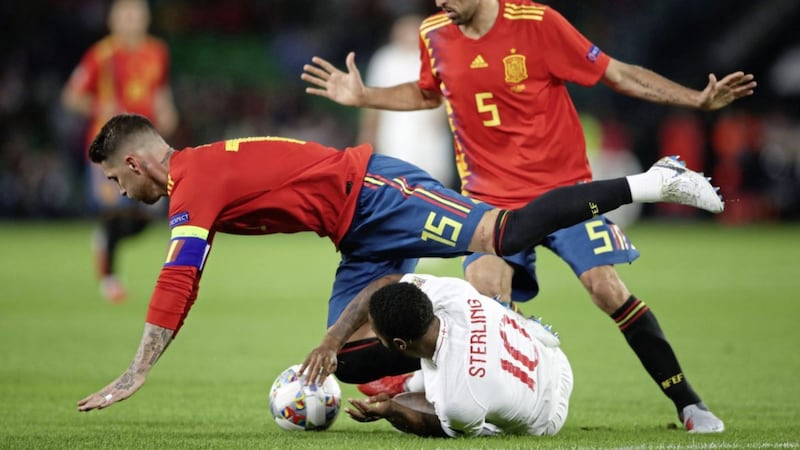 Spain&#39;s Sergio Ramos (top left) and Sergio Busquets and England&#39;s Raheem Sterling battle for the ball during the Nations League match at Benito Villamarin Stadium, Seville. Picture by Nick Potts/PA Wire. 