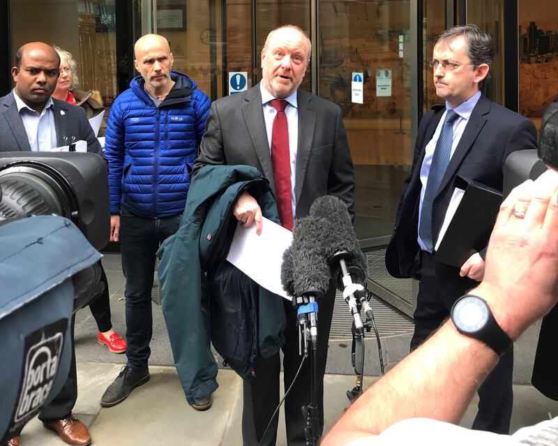 Alan Bates (centre) speaking outside the High Court in London, after the first judgment was handed down in claims against the Post Office over its computer system