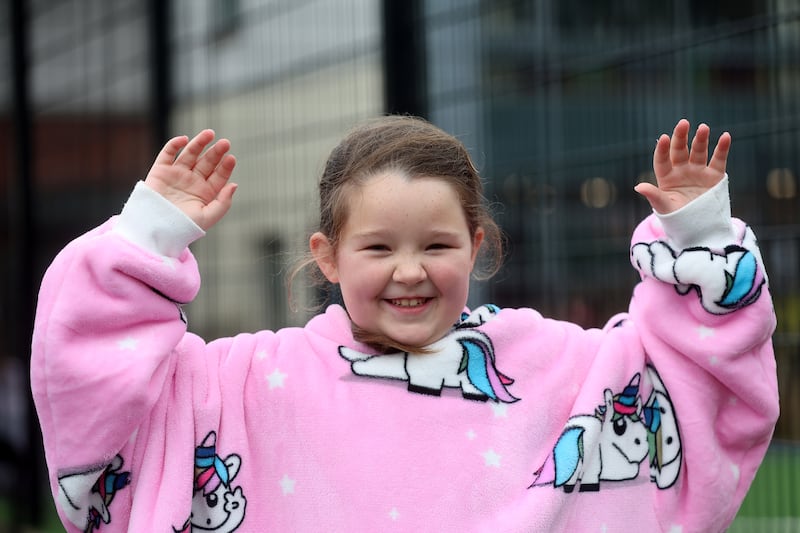 School children from St Kevin's Primary School in west Belfast take part in a sponsored PJ day to raise money for charity, pupil Meabh Smith lost her mum last year to ovarian cancer. All the children and staff dressed up in onesies, oddies and various other colourful pyjamas PICTURE MAL MCCANN