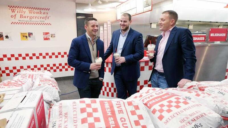 Owners of the Five Guys franchise in Ireland, brothers Ross, Dery and Brett Desmond in the new Victoria Square outlet 