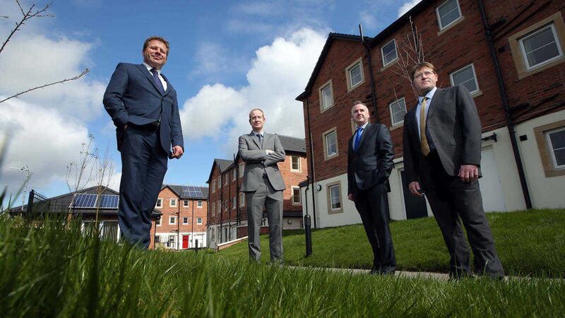 Pictured on site at a Triangle Housing Association development in Belfast yesterday are Ulster Bank&#39;s Kenton Hilman and Paul Herbison with Raymond Nicholl and Alan Crilly from Triangle House Association. 