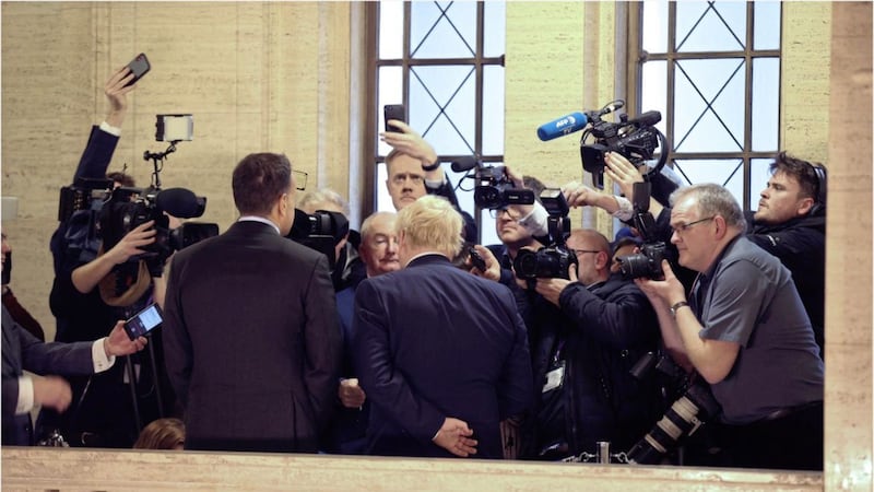 Leo Varadkar and Boris Johnson surrounded by the press at Stormont. Picture by Hugh Russell 