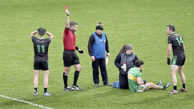 Tomas McCann (left) of Cargin couldn&#39;t believe it when the referee issued a red for a tackle on Glen&#39;s Conleith McGuckian Picture Margaret McLaughlin. 