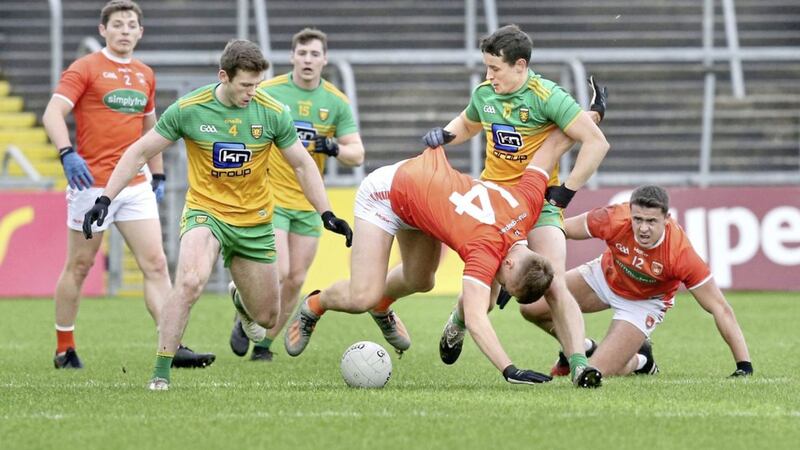 Donegal's Eoin McHugh challenges Rian O'Neill (14) of Armagh during their Ulster SFC semi-final in November 2020. <br />Picture Margaret McLaughlin