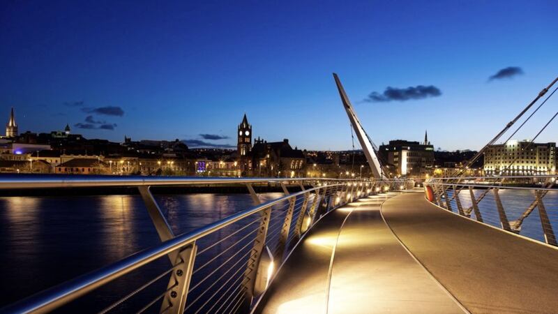 Derry at night from the Peace Bridge which links the two banks of the city 