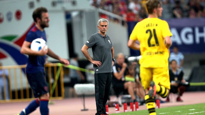 Manchester United head coach Jose Mourinho watches on as Juan Mata prepares to take a throw-in during Friday's International Champions Cup match against Borussia Dortmund in Shanghai<br />Picture by AP&nbsp;