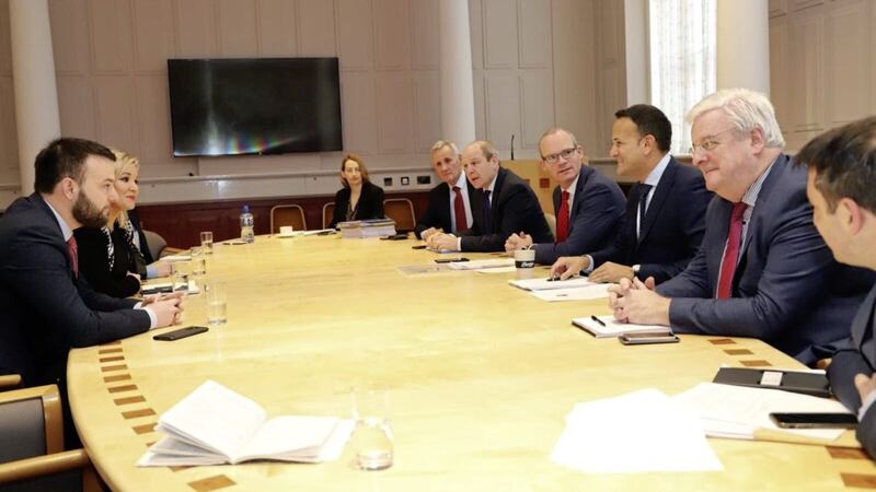 Leo Varakar and Simon Coveney meeting with the Northern Ireland remain parties in Dublin yesterday. 