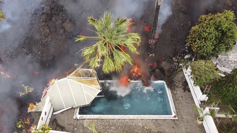 Hot lava reaches a swimming pool after an eruption of a volcano on the island of La Palma in the Canaries, Spain, Monday, September 20, 2021 (Europa Press via AP)&nbsp;