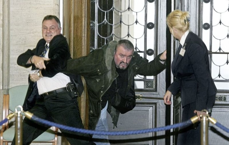 &nbsp;Michael Stone is restrained and disarmed by security staff in Parliament Buildings in November 2006. Picture by Mal McCann