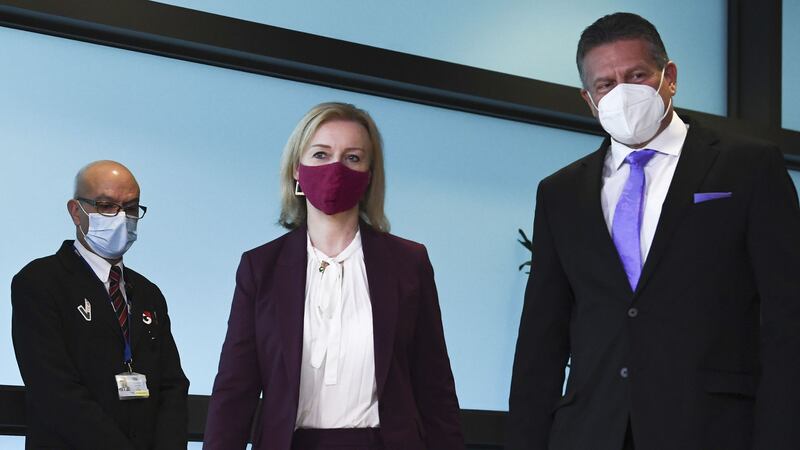 European Commissioner for Inter-institutional Relations and Foresight Maros Sefcovic, right, walks with British Foreign Secretary Liz Truss, center, prior to a meeting at EU headquarters in Brussels, Monday  January 24, 2022 (John Thys, Pool Photo via AP)&nbsp;