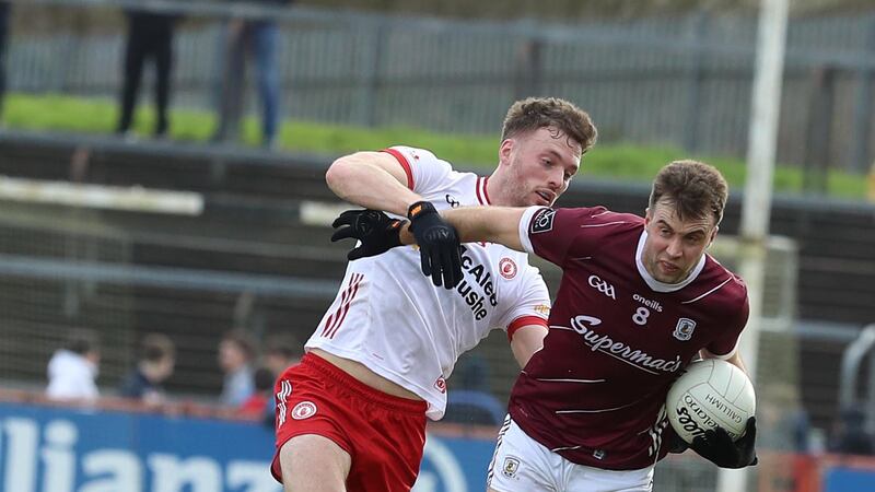 Tyrone's Brian Kennedy and Galway's Paul Conroy in action
