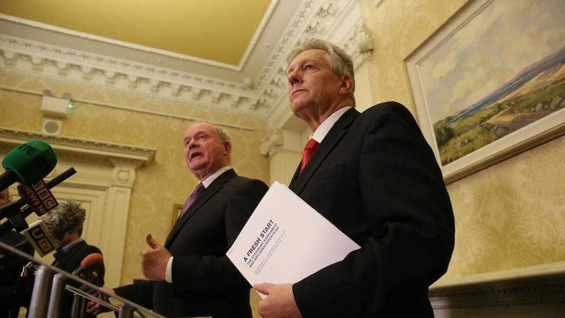 First Minister Peter Robinson speaks alongside Deputy First Minister Martin McGuinness at Stormont Castle. Picture by Brian Lawless, Press Association