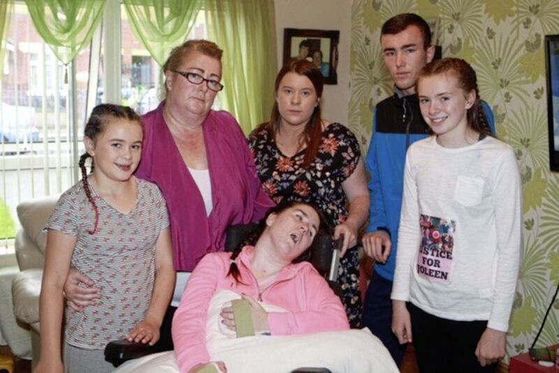 Joleen Corr, pictured with her family, died 17 months after she was found with a serious head injury in her home in Downpatrick in December 2016 