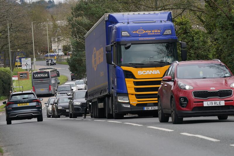 Vehicles on the A245 approaching Parvis Road bridge in Byfleet