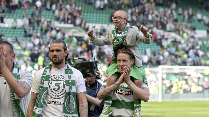 Jay Beatty, Ambassador for Celtic Football Club&#39;s Celtic FC Foundation, is carried on the shoulders of Celtic player, Stefan Johansen at Celtic Park. Photo by Andrew Milligan/PA Wire 
