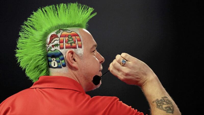               Peter Wright with Christmas jumpers painted onto the side of his head on Christmas Jumper Day during day two of the William Hill World Darts Championship at Alexandra Palace, London. PRESS ASSOCIATION Photo. Picture date: Friday December 16, 2016. See PA story DARTS World. Photo credit should read: John Walton/PA Wire. RESTRICTIONS: Use subject to restrictions. Editorial use only. No commercial use. Call +44 (0)1158 447447 for further information.             