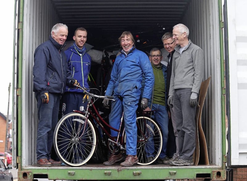 David MacCauley, Brendan McCartan and Colin Kirkpatrick and helpers with the Adsum Foundation based in Belfast&rsquo;s Ormeau Road stack hundreds of bikes into a container bound for Madagascar Picture Mal McCann 