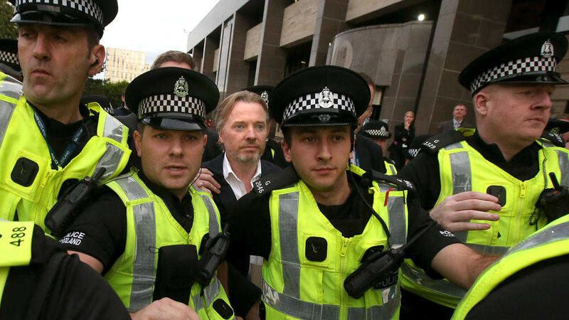 Former owner of Glasgow Rangers, Craig Whyte (centre) leaves Glasgow Sheriff Court after he appeared as part of a Police Scotland investigation into Rangers football club. PRESS ASSOCIATION Photo. Picture date: Wednesday September 2, 2015. See PA story COURTS Rangers. Photo credit should read: Andrew Milligan/PA Wire. 