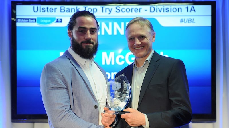 Division 1A top try scorer&nbsp;Mick McGrath of&nbsp;Clontarf receives his award from Ireland's Head Coach Joe Schmidt<br />Picture by Sportsfile