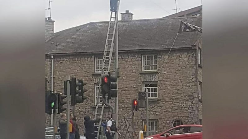 Police were pictured nearby as a banner in support of &#39;British veterans&#39; was erected at a busy junction in Armagh 