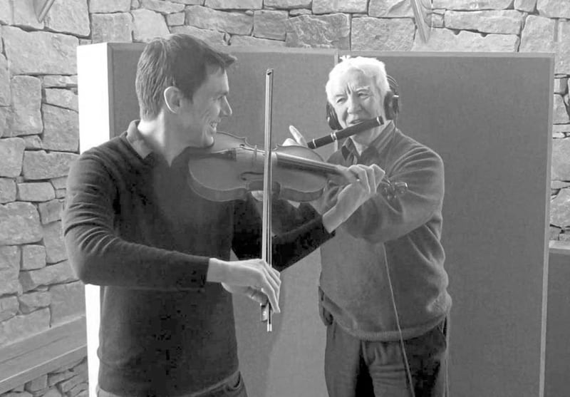 Liam O&#39;Connor performs with his father, flute player Mick O&rsquo;Connor 