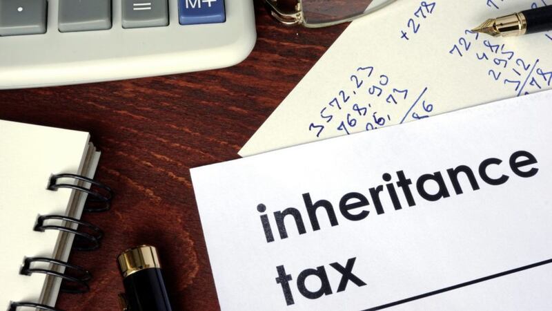 Inheritance tax written on a paper. Financial concept.. 