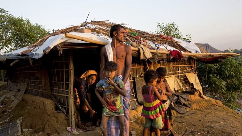 A Rohingya family settles in at Kutupalong refugee camp, Bangladesh in early November 