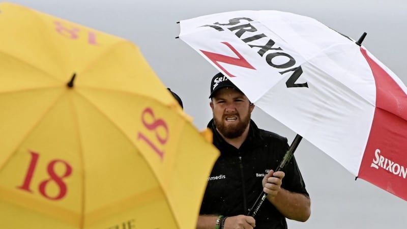 Ireland&#39;s Shane Lowry sheltering from the torrential rain on the final day of the 148th Open Championship at Royal Portrush. 